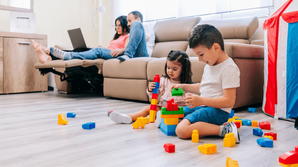 Parent with laptop and Kids playing each other