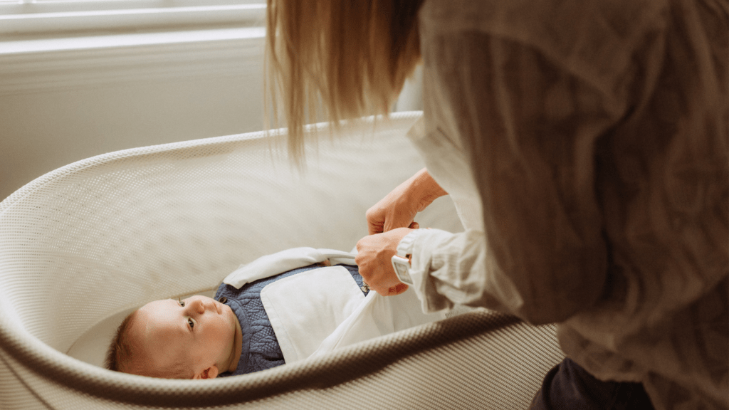 Mother wrapping the baby