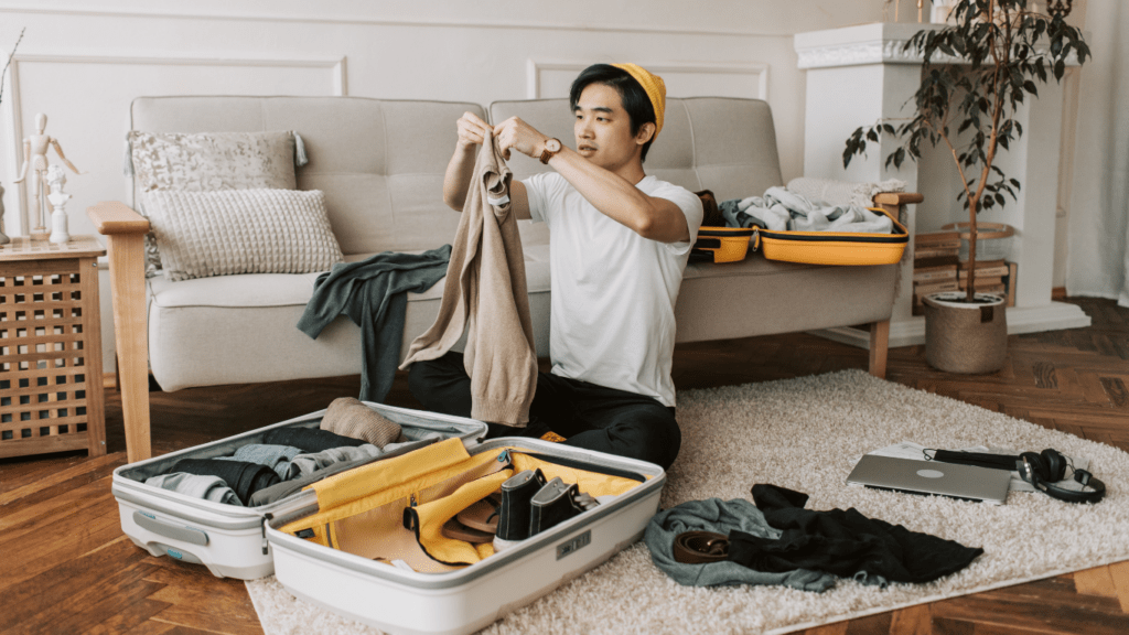 Man Packing clothes for travel