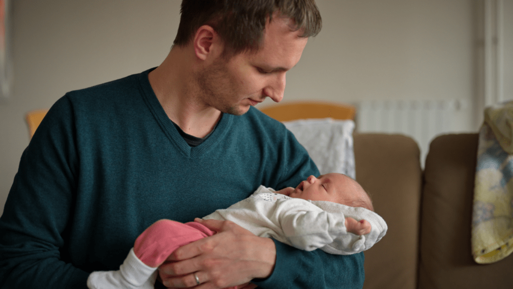 Father holding a baby 